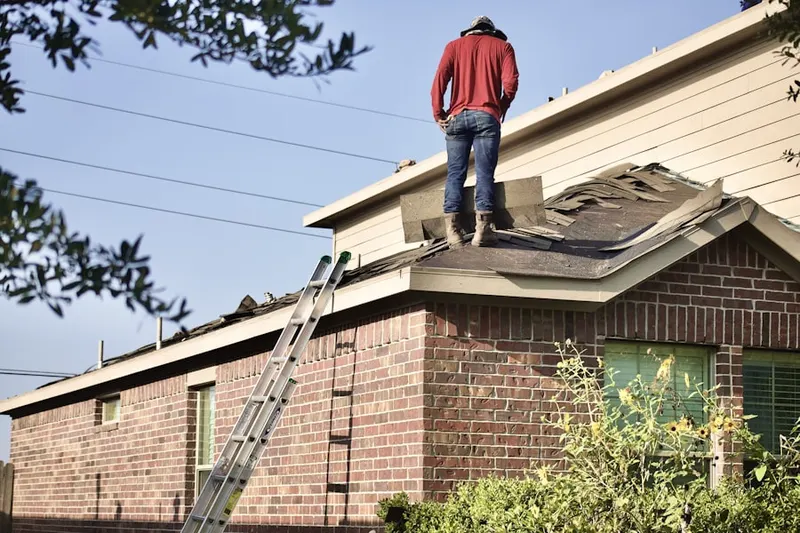 Professional roofer working on a residential roof in America